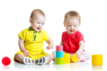 Babies playing with toys