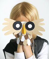 child holding owl puppet